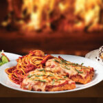 chicken parmesan, salad, and a cannoli